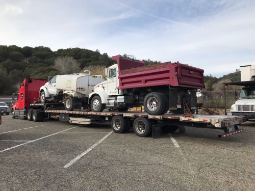 Dump truck on trailer Dump truck on trailer