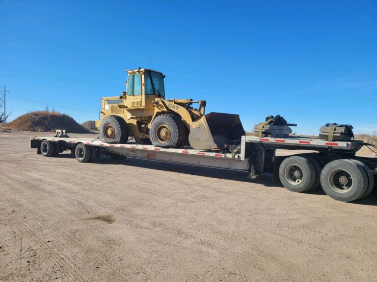 wheel loader on step deck for transport