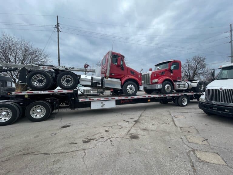 Semi trucks prepped for transport
