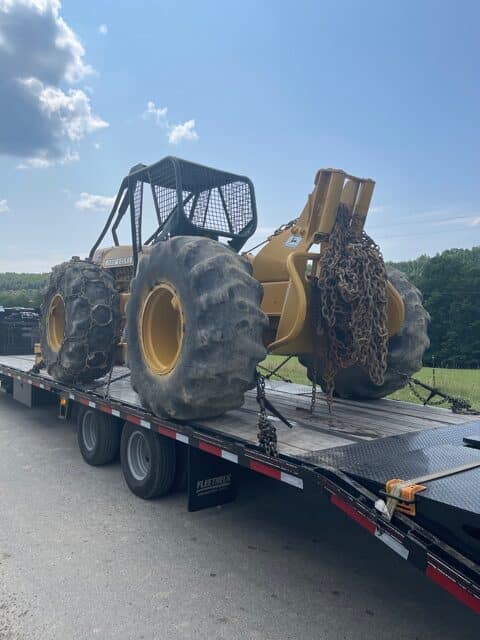 John Deere tractor on trailer for transport
