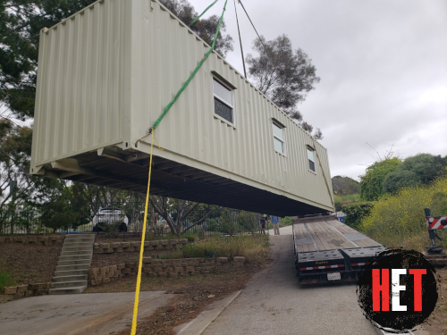 Container being loaded on trailer.