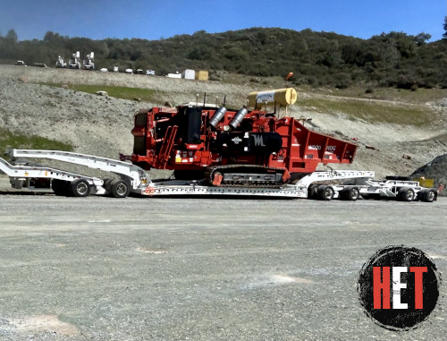 Cold planer transported on trailer.