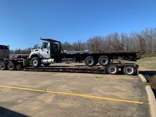 Roll off truck transport