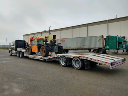 telehandler on trailer for transport