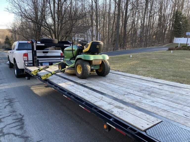 John Deere lawn mower on hot shot trailer