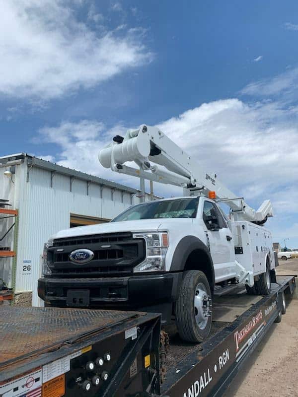 Ford utility truck on step deck trailer