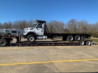 Roll off truck transport