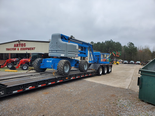 Telescopic boom lift on RGN trailer
