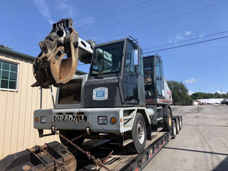 Machinery loaded onto trailer