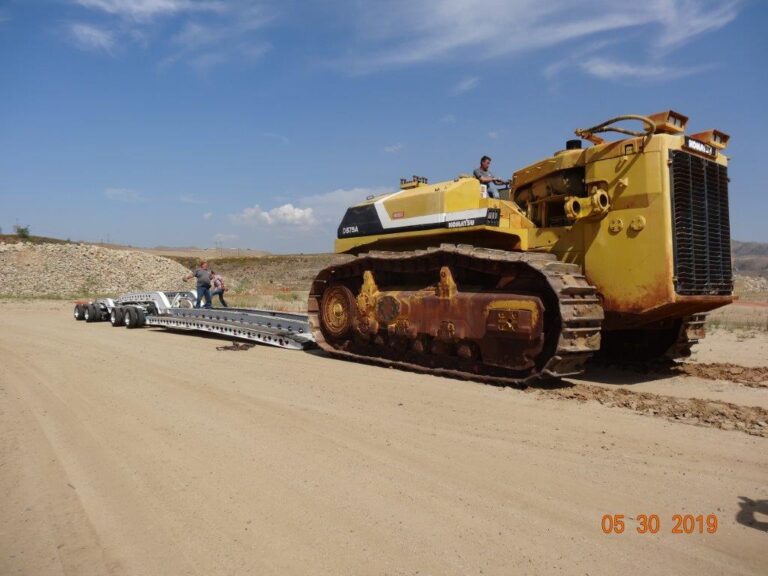 crawler dozer being loaded on trailer
