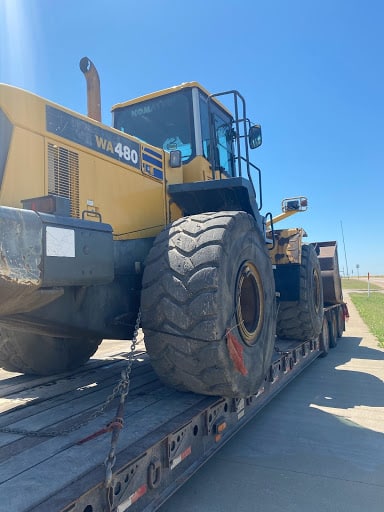 wheel loader on lowboy trailer