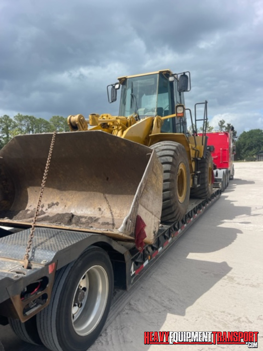 Bulldozer transported on a trailer.