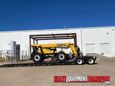 2017 Gehl 10K Reach Forklift loaded for transport on a double drop trailer