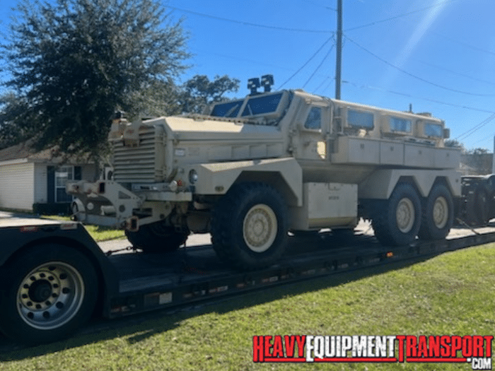 truck on lowboy trailer