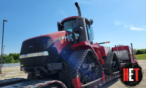 Case IH 620 Quadrac Tractor loaded for transport.