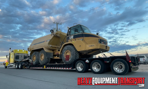 Catepillar rock truck transported on a trailer.