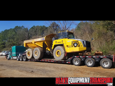 Komatsu HM400-5 articulated dump truck transport.