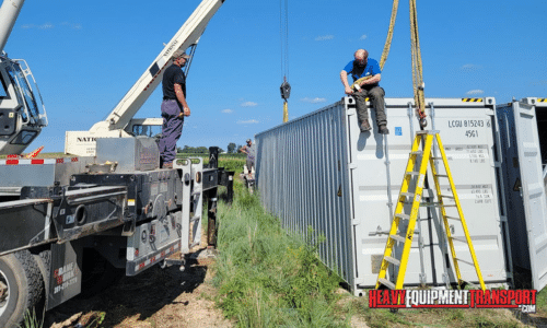 Container being strapped for crane loading