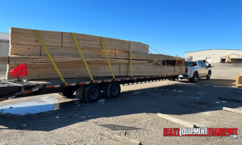 Lumber transported on a flatbed trailer.