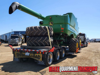 John Deere 310SG backhoe loader haul.