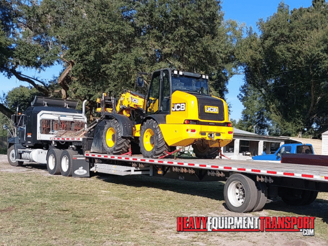 jcb tractor on step deck trailer