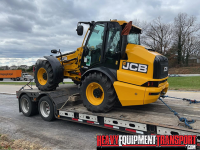 Transporting a Jcb tm320 wheel loader.