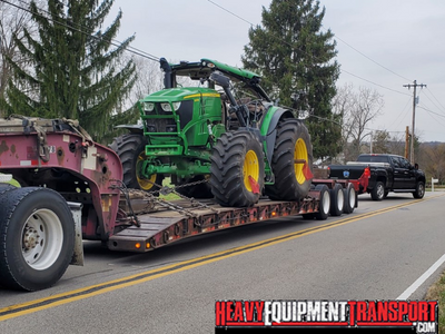 Hauling a John deere 6215 tractor.