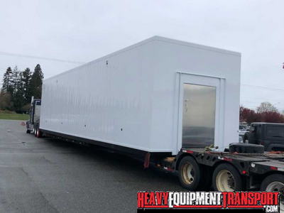 Transporting a carcass cooler module container .