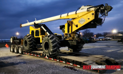 Transporting a tree trimmer.
